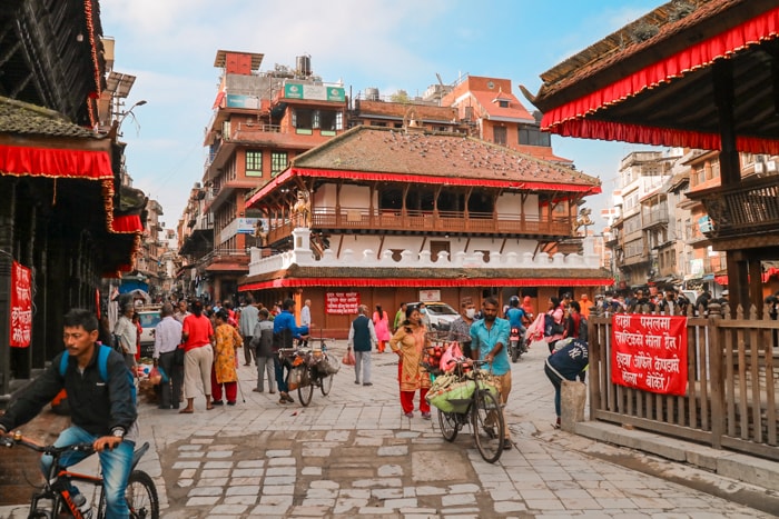 Living in Kathmandu as an Expat - People cross the busy street near Kathmandu Durbar Square