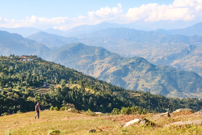 A trekker walks through a field in Pumdi Bhumdi Nepal