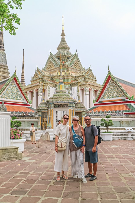 Michelle, Suraj and mom standing in front of Wat Pho - Best Things to do in Bangkok
