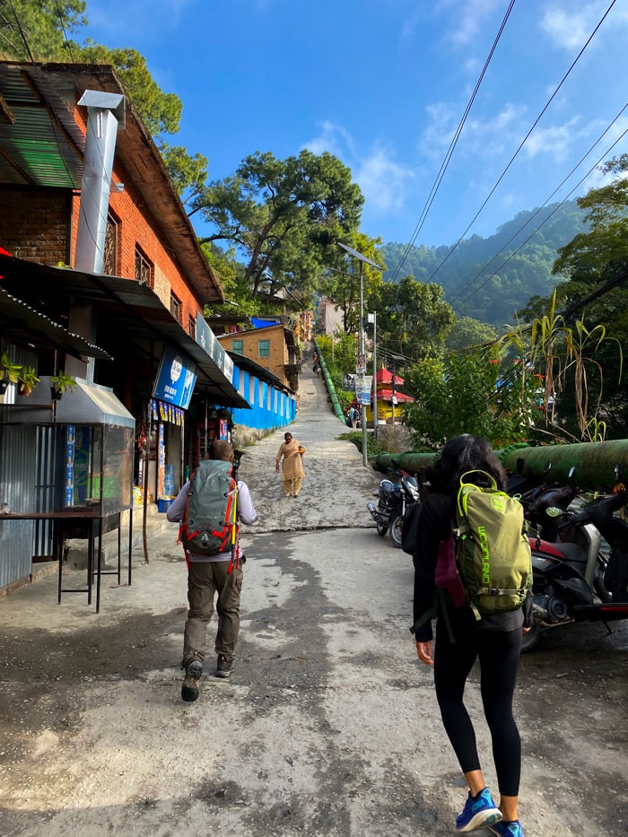 The starting point of the trek at Sudarijal entrance to Shivapuri National Park where hikers climb a steep hill with tea shops on the side